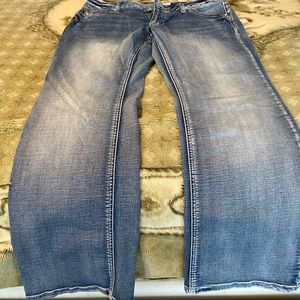 Women’s lightwash bootcut jeans back pocket detail